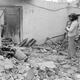 A Sikh father with his child amidst the rubble that was once their home in New Delhi in November 1984.
